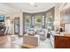 Bright sitting area with natural light, comfortable seating, and backyard view at 6060 Country Lake Rd, Cumming, GA 30041