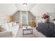 Sitting room features vaulted ceiling, natural light and neutral decor and built-in shelving at 6060 Country Lake Rd, Cumming, GA 30041