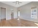 Spacious bedroom with natural light and a glimpse into the elegant ensuite bathroom at 1130 Lupo Loop, Chattahoochee Hills, GA 30268