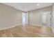 Bright bedroom featuring hardwood floors, neutral walls, and white trim and doors at 1130 Lupo Loop, Chattahoochee Hills, GA 30268