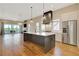 Modern kitchen featuring a large island, stainless steel appliances, and plenty of natural light at 1130 Lupo Loop, Chattahoochee Hills, GA 30268