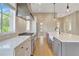 Bright kitchen featuring stainless appliances, white cabinets, and an open layout at 1130 Lupo Loop, Chattahoochee Hills, GA 30268