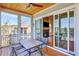Inviting screened-in patio with a ceiling fan and an outdoor table with seating at 1130 Lupo Loop, Chattahoochee Hills, GA 30268