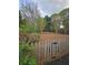 Spacious backyard featuring mature trees, a wooden fence and a neatly mulched ground cover at 2012 Grove Park Ct, Marietta, GA 30062