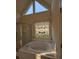 Bathroom features a swan-themed stained glass window above a tile-lined soaking tub at 2012 Grove Park Ct, Marietta, GA 30062