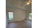 Bright bedroom featuring neutral walls, light flooring, and a ceiling fan at 2012 Grove Park Ct, Marietta, GA 30062