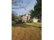 Charming two-story home with a brick facade and a well-manicured front lawn at 2012 Grove Park Ct, Marietta, GA 30062