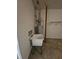 Garage interior featuring a utility sink, hot water heater, and concrete floors at 2012 Grove Park Ct, Marietta, GA 30062