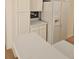 Close up view of the kitchen area featuring a refrigerator and white countertops at 2012 Grove Park Ct, Marietta, GA 30062