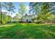 Spacious backyard with a wooden deck and lush lawn, ideal for outdoor activities at 4166 Rue Saint Michel, Stone Mountain, GA 30083