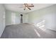 Large bedroom features carpet, neutral walls, and has both a bathroom and walk-in closet at 4166 Rue Saint Michel, Stone Mountain, GA 30083