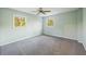 Light-filled bedroom with neutral walls, a ceiling fan and cozy gray carpet at 4166 Rue Saint Michel, Stone Mountain, GA 30083