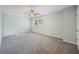 Light-filled bedroom with neutral walls, ceiling fan, and cozy gray carpet at 4166 Rue Saint Michel, Stone Mountain, GA 30083