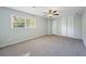 Large bedroom features carpet, neutral walls, and built in closets at 4166 Rue Saint Michel, Stone Mountain, GA 30083