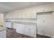 A bright kitchen features white cabinets, ample counter space, and modern flooring at 4166 Rue Saint Michel, Stone Mountain, GA 30083