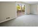 Bright living room features sliding glass doors that open to a deck at 4166 Rue Saint Michel, Stone Mountain, GA 30083