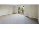 The living room is spacious and bright with sliding doors for outdoor access at 4166 Rue Saint Michel, Stone Mountain, GA 30083