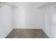 Spacious walk-in closet with neutral carpet and overhead shelving at 4166 Rue Saint Michel, Stone Mountain, GA 30083