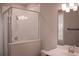 Bathroom featuring a glass-enclosed shower and a vanity with a large mirror at 600 Broadview Ne Ter, Atlanta, GA 30324