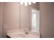 Simple bathroom featuring a vanity with a dark wood cabinet, white countertop and a mirror at 600 Broadview Ne Ter, Atlanta, GA 30324