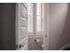 Cozy bathroom featuring a window with white shutters for natural light and privacy at 600 Broadview Ne Ter, Atlanta, GA 30324