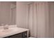 Simple bathroom featuring a vanity with a dark wood cabinet and a mirror at 600 Broadview Ne Ter, Atlanta, GA 30324
