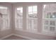 Bright bedroom featuring three large windows with white shutters offering ample natural light at 600 Broadview Ne Ter, Atlanta, GA 30324