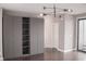 An open bedroom features a modern wardrobe, balcony access, and hardwood flooring at 600 Broadview Ne Ter, Atlanta, GA 30324