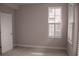 Bedroom with gray walls, white doors, white shutters and carpeting at 600 Broadview Ne Ter, Atlanta, GA 30324