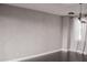 A modern bedroom with gray walls, dark hardwood flooring, and modern light fixtures at 600 Broadview Ne Ter, Atlanta, GA 30324