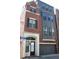Beautiful townhome with brick and modern siding, attached two-car garage and arched entry at 600 Broadview Ne Ter, Atlanta, GA 30324