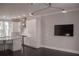 Open-concept space with living room, kitchen with stainless steel appliances, granite countertops, island, and hardwood floors at 600 Broadview Ne Ter, Atlanta, GA 30324