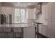 Modern kitchen with island, granite countertops, stainless appliances, and ample cabinet space at 600 Broadview Ne Ter, Atlanta, GA 30324