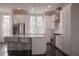 Bright modern kitchen with island, pendant lighting, stainless appliances, and hardwood floors at 600 Broadview Ne Ter, Atlanta, GA 30324