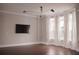 Bright living room with hardwood floors, large windows, and modern lighting fixtures at 600 Broadview Ne Ter, Atlanta, GA 30324