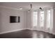 Living room with modern lighting, a wall-mounted TV, hardwood flooring, and an abundance of natural light at 600 Broadview Ne Ter, Atlanta, GA 30324