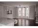 Bright living room featuring hardwood floors, large windows, and modern lighting fixtures at 600 Broadview Ne Ter, Atlanta, GA 30324