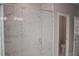 Large glass enclosed shower with tiled walls and multiple shower heads at 600 Broadview Ne Ter, Atlanta, GA 30324
