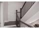 Beautiful staircase features dark wood treads, wrought iron railings, and natural light at 600 Broadview Ne Ter, Atlanta, GA 30324