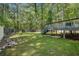 Spacious backyard with a deck offering ample space for outdoor activities and relaxation at 3076 Nectar Dr, Powder Springs, GA 30127