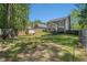 Fenced backyard with lush greenery, deck, and ample space for recreation and relaxation at 3076 Nectar Dr, Powder Springs, GA 30127
