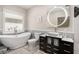 Bright bathroom featuring a modern soaker tub, vessel sink, and stylish fixtures at 3076 Nectar Dr, Powder Springs, GA 30127