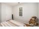 Charming bedroom with wood-look floors, neutral walls, and natural light from window at 3076 Nectar Dr, Powder Springs, GA 30127