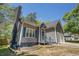 Charming gray home with blue shutters and beautiful landscaping at 3076 Nectar Dr, Powder Springs, GA 30127