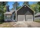 Charming home featuring a two-car garage, stone accents, and a well-manicured front yard at 3076 Nectar Dr, Powder Springs, GA 30127