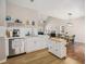 Modern kitchen with stainless steel appliances, white cabinets, and an eat-in dining area at 3076 Nectar Dr, Powder Springs, GA 30127