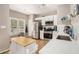 Well-lit kitchen with stainless steel appliances, white cabinets, and a center island at 3076 Nectar Dr, Powder Springs, GA 30127