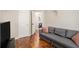 Cozy living room with hardwood floors, gray sofa, and television for relaxation and entertainment at 3076 Nectar Dr, Powder Springs, GA 30127