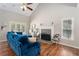 Inviting living room featuring a brick fireplace, hardwood floors, and neutral decor at 3076 Nectar Dr, Powder Springs, GA 30127