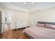 Comfortable bedroom featuring wood-look floors, neutral paint, and a double-door closet at 3076 Nectar Dr, Powder Springs, GA 30127